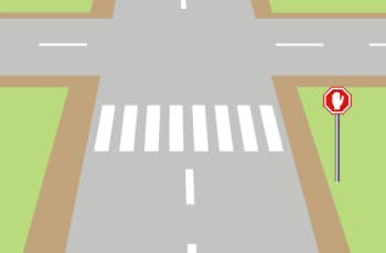 באיור נראה צומת, שלפניו מוצב תמרור עצור (מתומן אדום עם כף יד לבנה). על הכביש מסומן מעבר חצייה, אך אין קו עצירה.